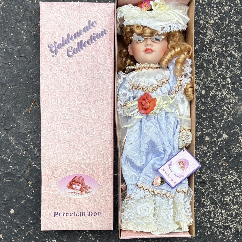 Goldenvale Collection Porcelain Doll with Blue Dress and Hat “Agatha”